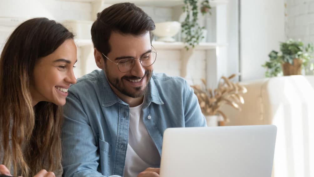Two homeowners review our HVAC financing offers as they consider how to pay for a new gas furnace.
