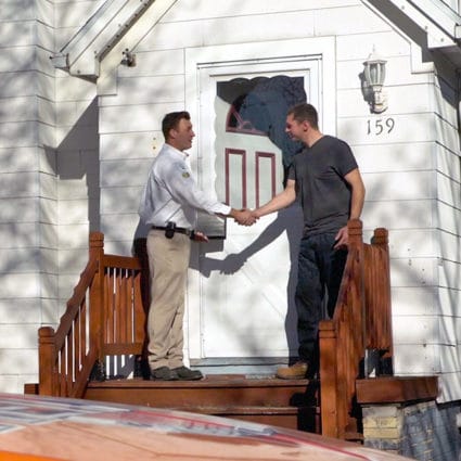 Called in for furnace repairs here in Buffalo, NY, our technician shakes the hand of a local homeowner at the door.