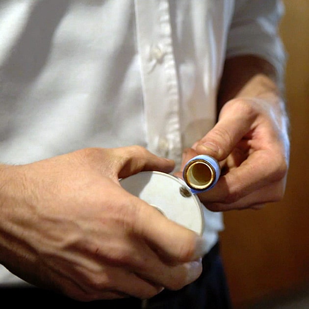 Our plumber fixes a part as part of a Niagara Falls' plumbing service call.